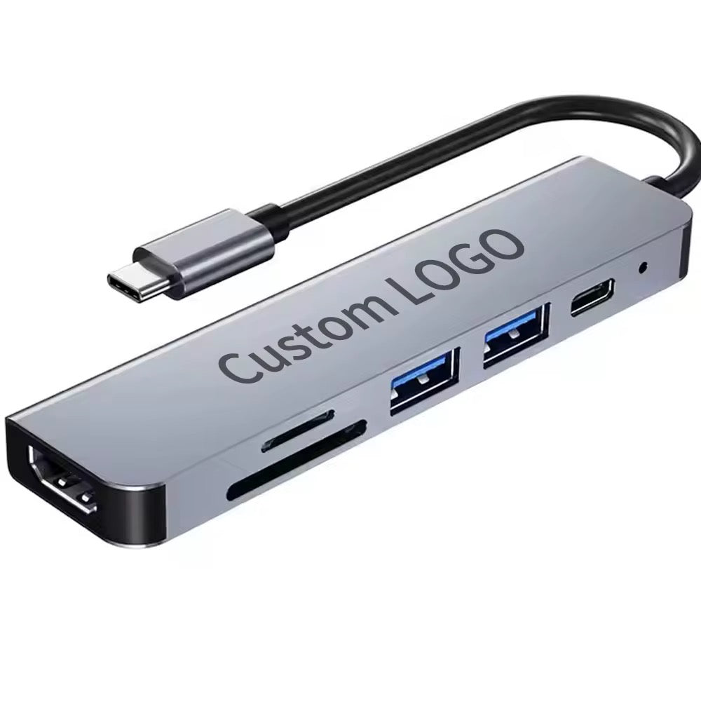Schlanker USB-Hub mit USB-3.0 Ports, SD-Slots und USB-C – große Fläche für individuelles Firmenlogo.